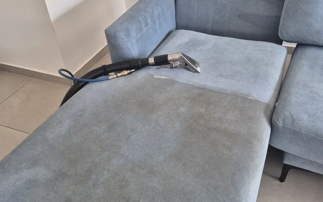 Corner sofa mid deep-clean — the clean area next to the dirty area